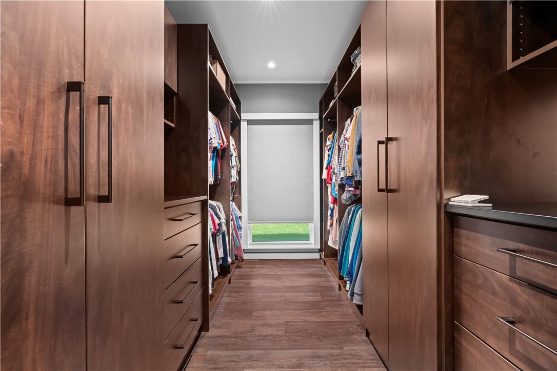 1506 Pleasant View Road Coopersburg, PA 18036 - Photo 49 of 97 Custom cabinetry and ample storage solutions create an organized and elegant walk-in wardrobe.
