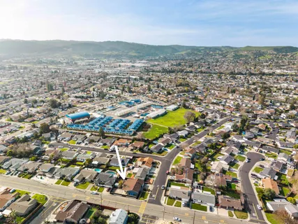 an aerial view of residential building with parking space