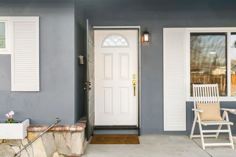 a front view of a house with garden