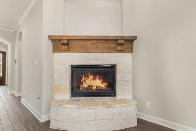 a view of fireplace with wooden floor