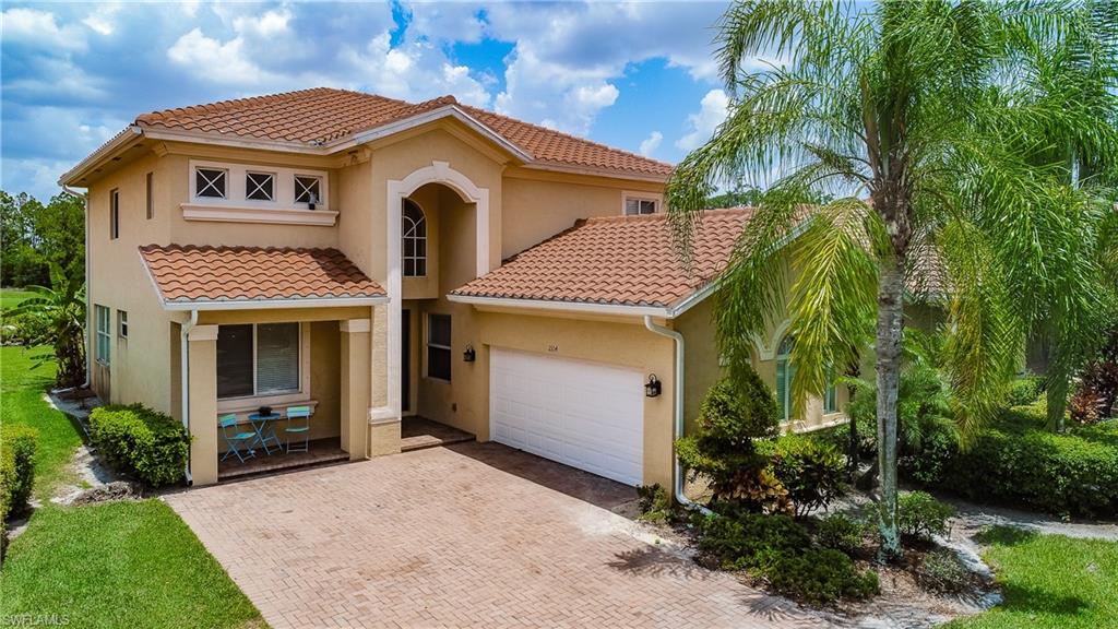 2104 Par Drive Naples, FL 34120 - Photo 1 of 26 a front view of a house with garden