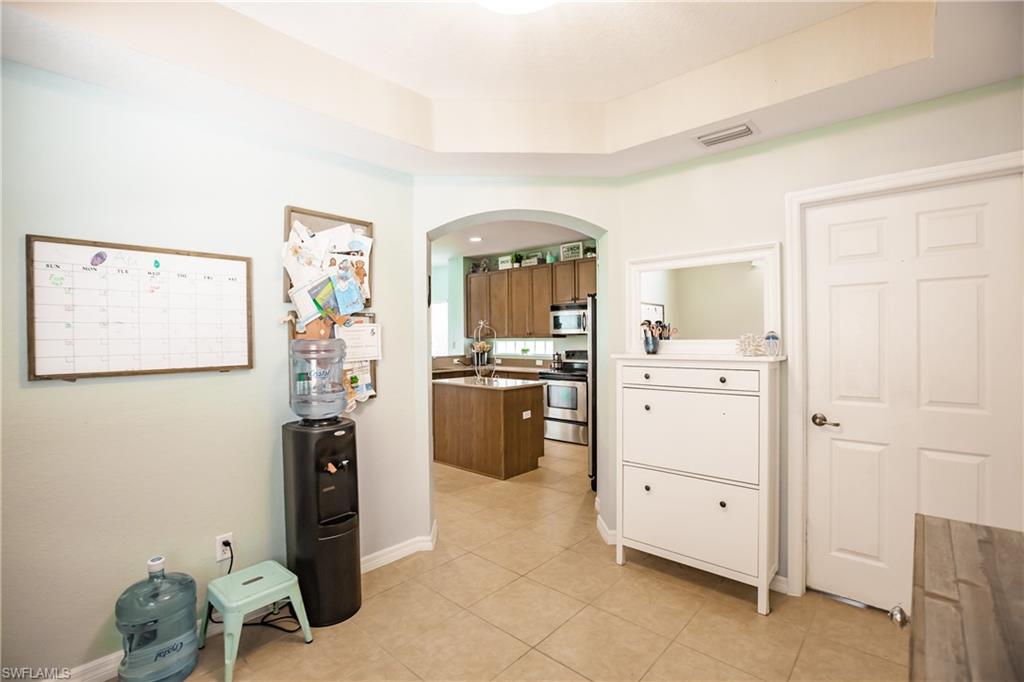 2104 Par Drive Naples, FL 34120 - Photo 13 of 26 a room with storage and utility