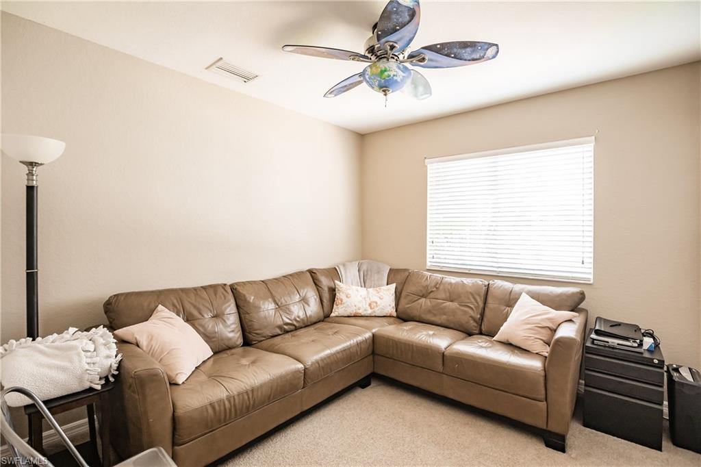 2104 Par Drive Naples, FL 34120 - Photo 21 of 26 a living room with furniture and a window
