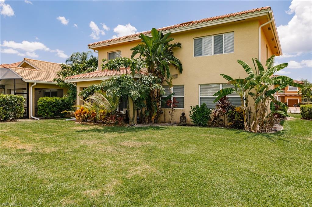 2104 Par Drive Naples, FL 34120 - Photo 26 of 26 a view of a house with a backyard