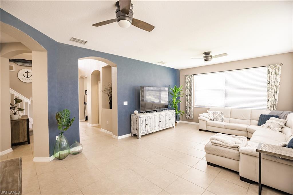 2104 Par Drive Naples, FL 34120 - Photo 4 of 26 a living room with furniture and a large window