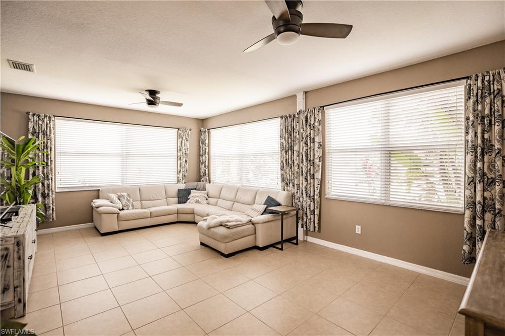 2104 Par Drive Naples, FL 34120 - Photo 5 of 26 a living room with furniture and a large window