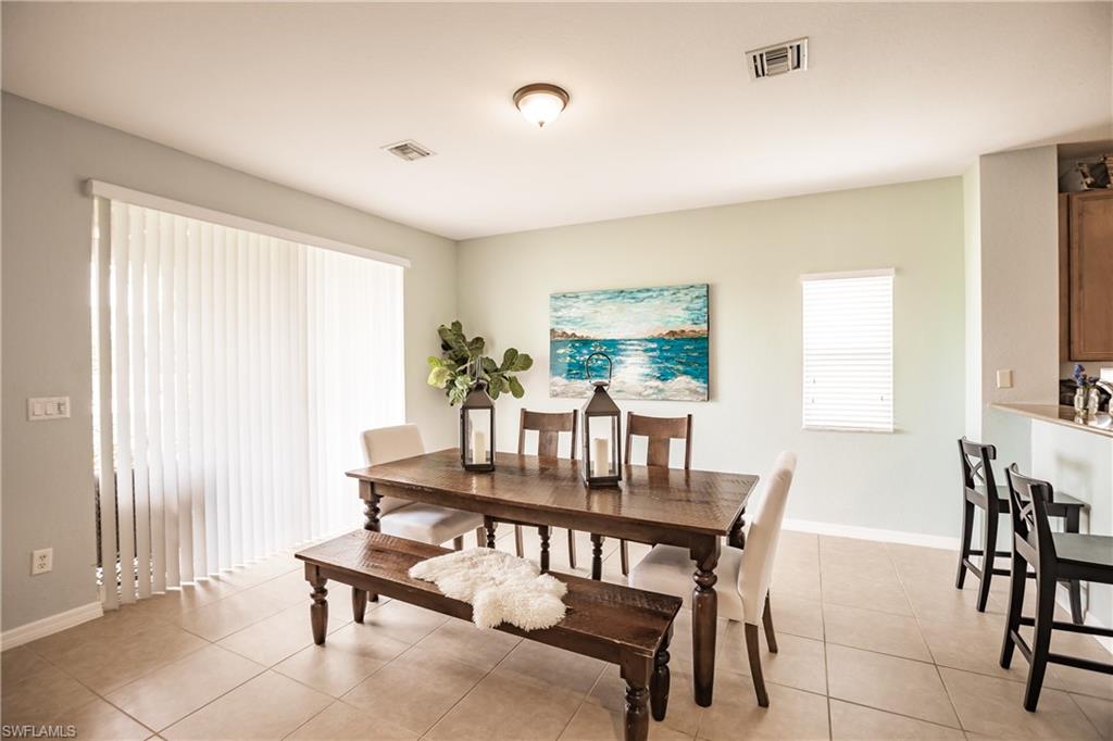 2104 Par Drive Naples, FL 34120 - Photo 6 of 26 a dining room with furniture and window