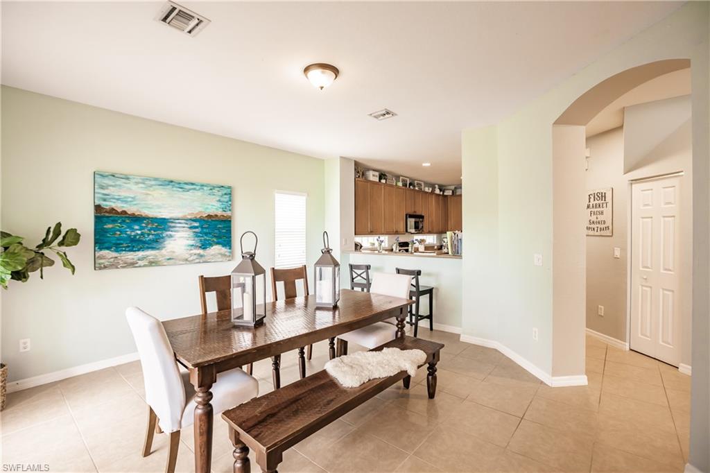 2104 Par Drive Naples, FL 34120 - Photo 7 of 26 a dining room with furniture and window