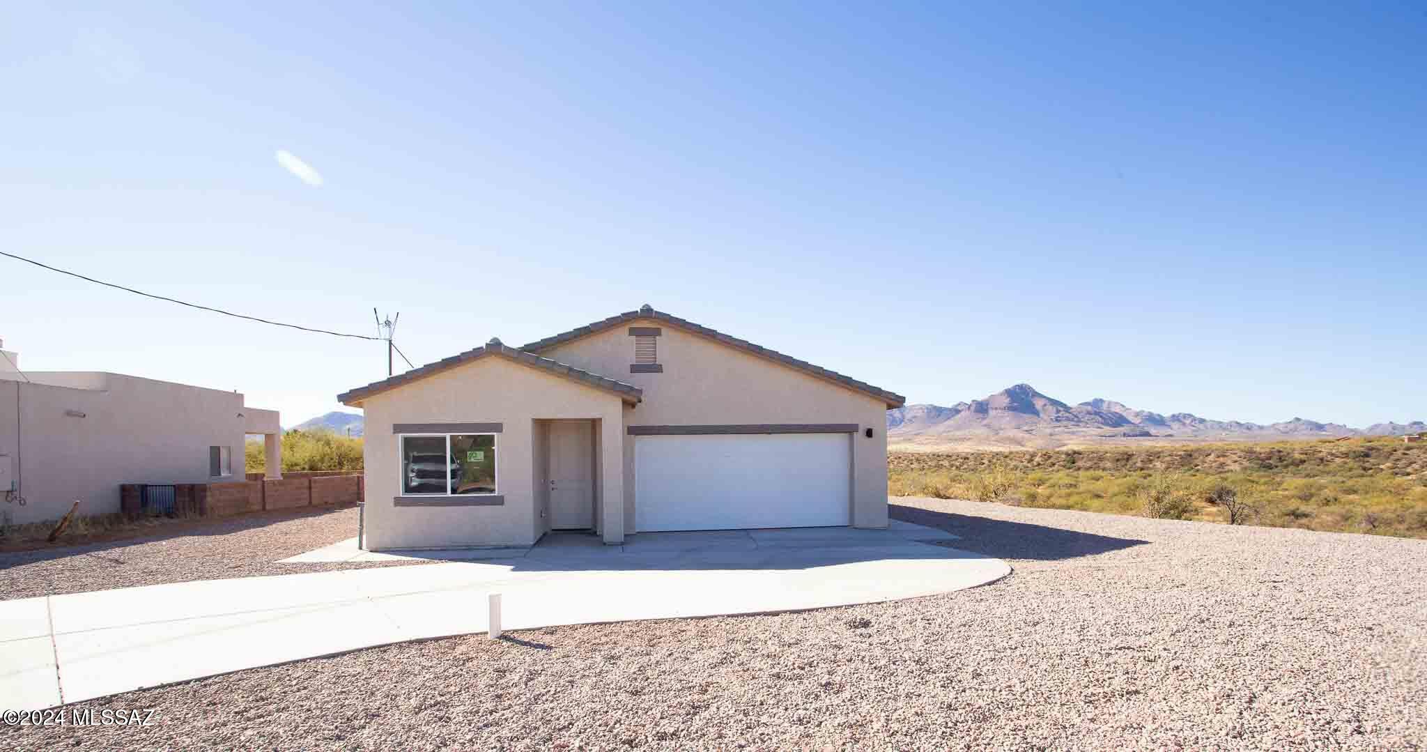 1704 Milo COrte Rio Rico, AZ 85648 - Photo 1 of 2 a house with a outdoor space