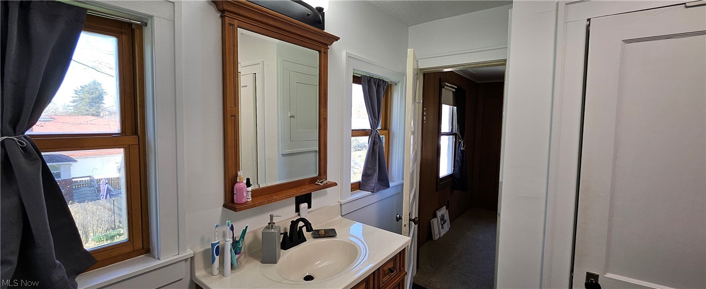 1050 Cambridge Road Coshocton, OH 43812 - Photo 38 of 50 Bathroom with vanity with extensive cabinet space