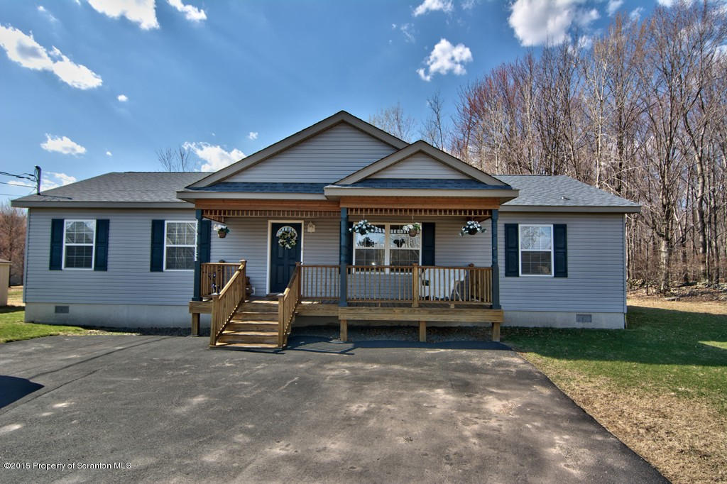 2744 Boulder Road Lake Ariel, PA 18436 - Photo 1 of 47 a front view of a house with garden