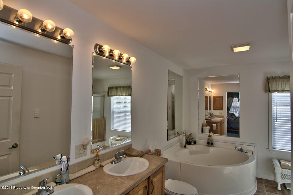 2744 Boulder Road Lake Ariel, PA 18436 - Photo 11 of 47 a bathroom with a double vanity sink and a mirror