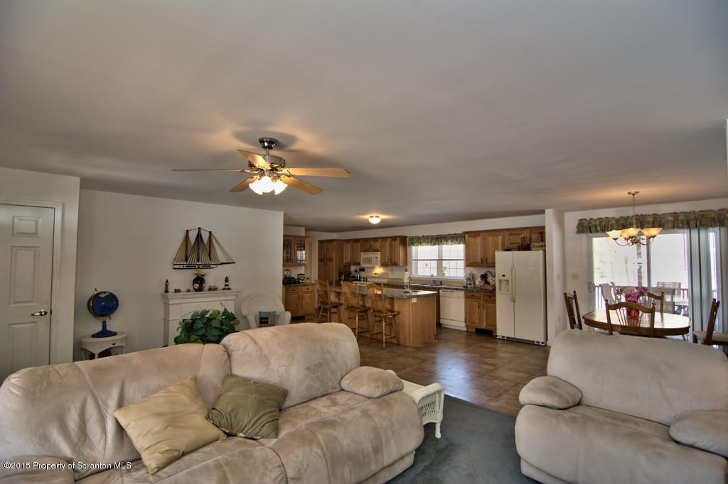 2744 Boulder Road Lake Ariel, PA 18436 - Photo 21 of 47 a living room with furniture and a chandelier
