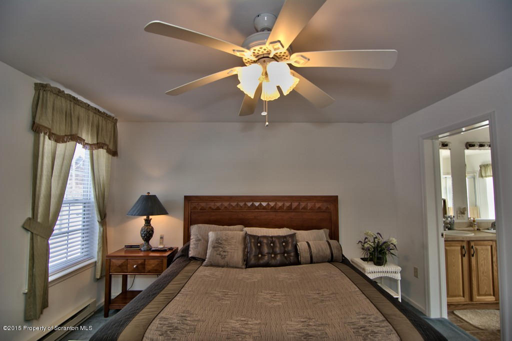 2744 Boulder Road Lake Ariel, PA 18436 - Photo 35 of 47 a bedroom with a bed and wooden floor