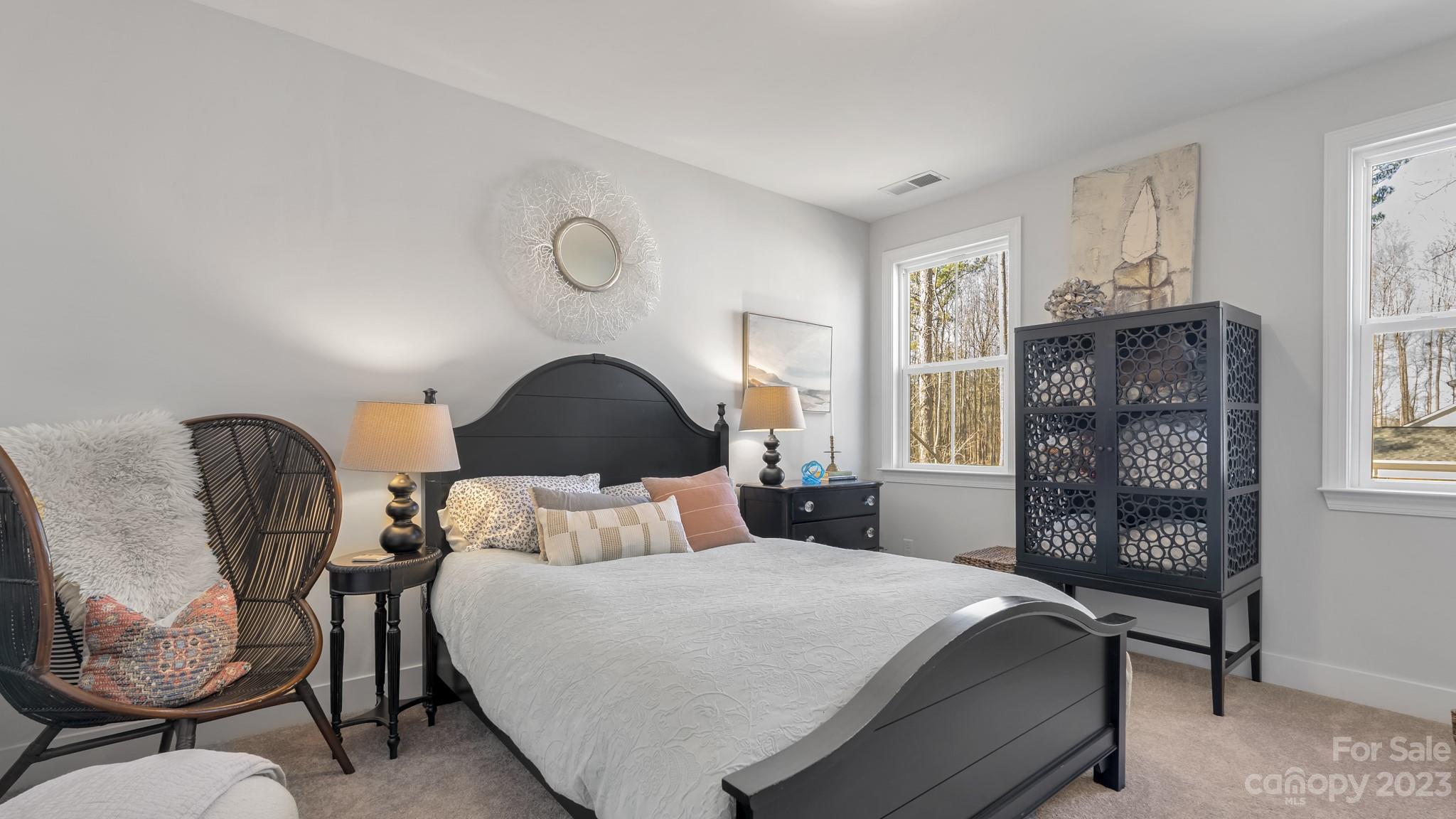 5351 Fewell Road Clover, SC 29710 - Photo 20 of 27 a bedroom with a bed a chair and potted plant