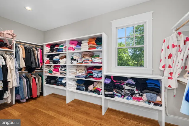 a view of a play room with clothes and shoes