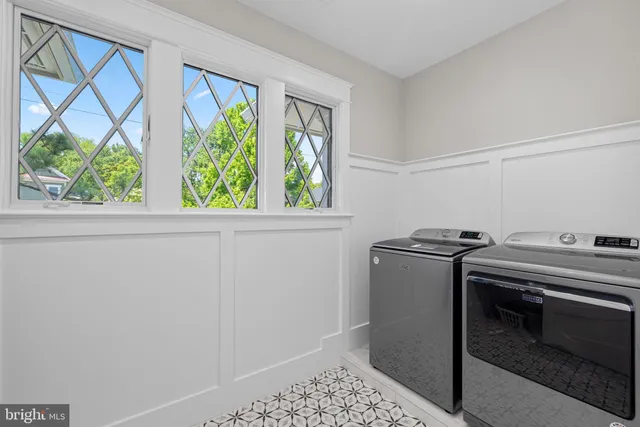 a view of an empty room with windows