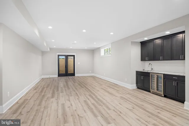 a view of a room with cabinet flat screen tv and refrigerator