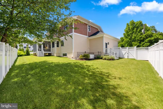a large tree in front of a house