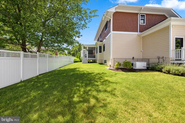 a view of a backyard with plants and a patio