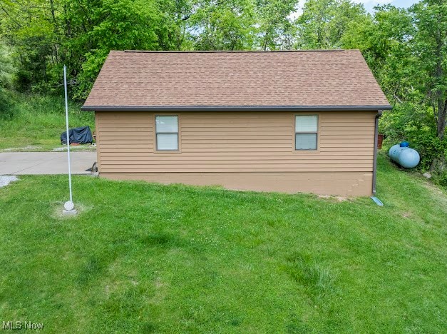 631 Short Brook Road Vincent, OH 45784 - Photo 7 of 31 View of home's exterior with a lawn and a shingled roof