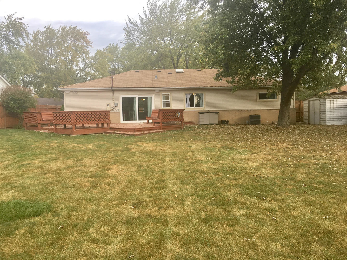 45 Bradley Lane Hoffman Estates, IL 60169 - Photo 11 of 12 a front view of a house with yard and trees