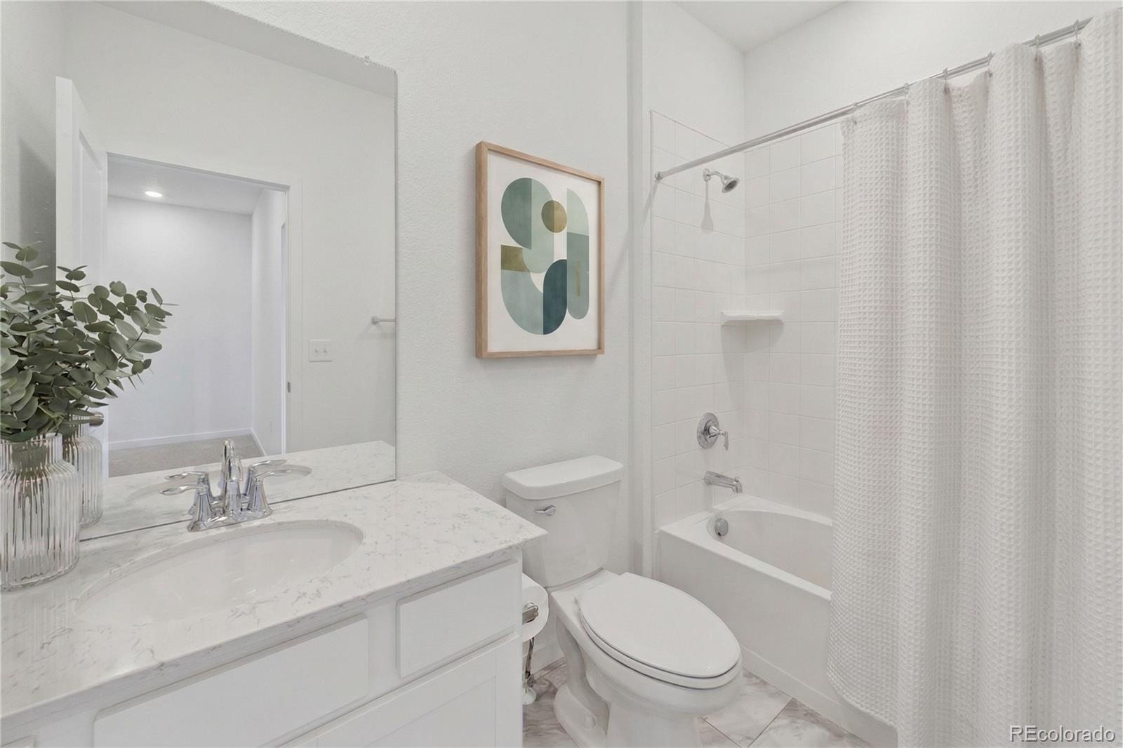 1964 South Gold Bug Way Aurora, CO 80018 - Photo 10 of 15 a bathroom with a sink toilet a mirror and shower