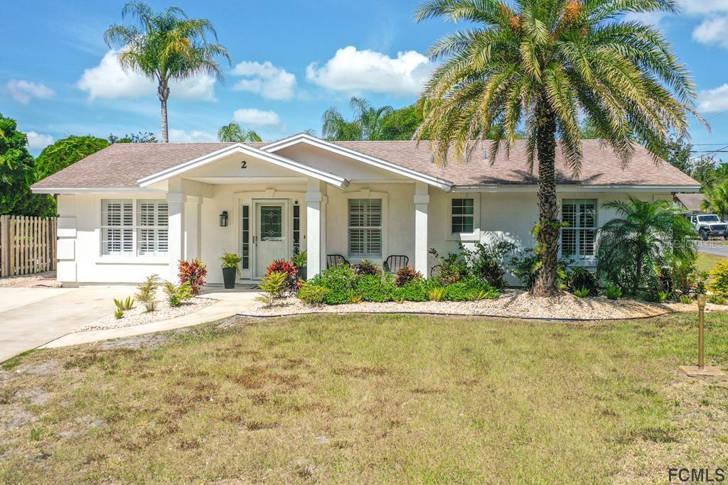 2 Atlantic Oaks Circle St. Augustine, FL 32080 - Photo 1 of 1 a front view of a house with garden and patio