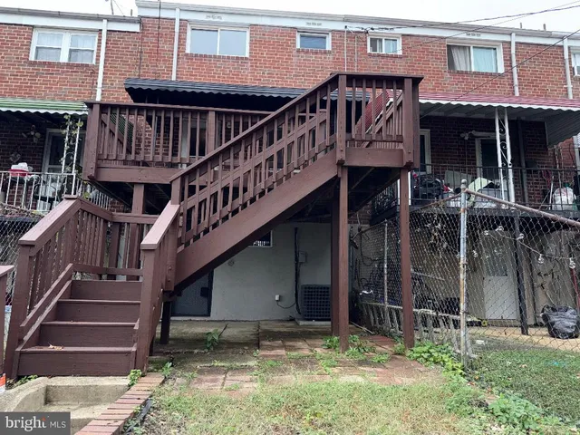 a view of a house with wooden stairs