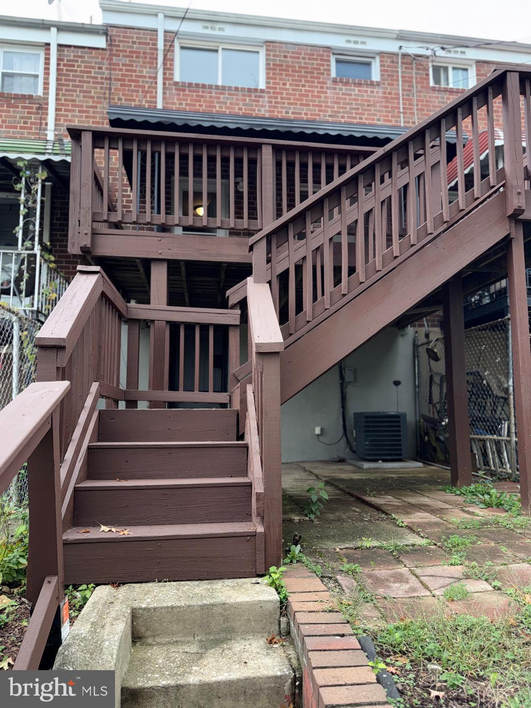 645 Queensgate Road Baltimore, MD 21229 - Photo 15 of 21 a view of a house with a deck