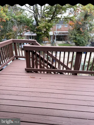 a view of a balcony with wooden floor