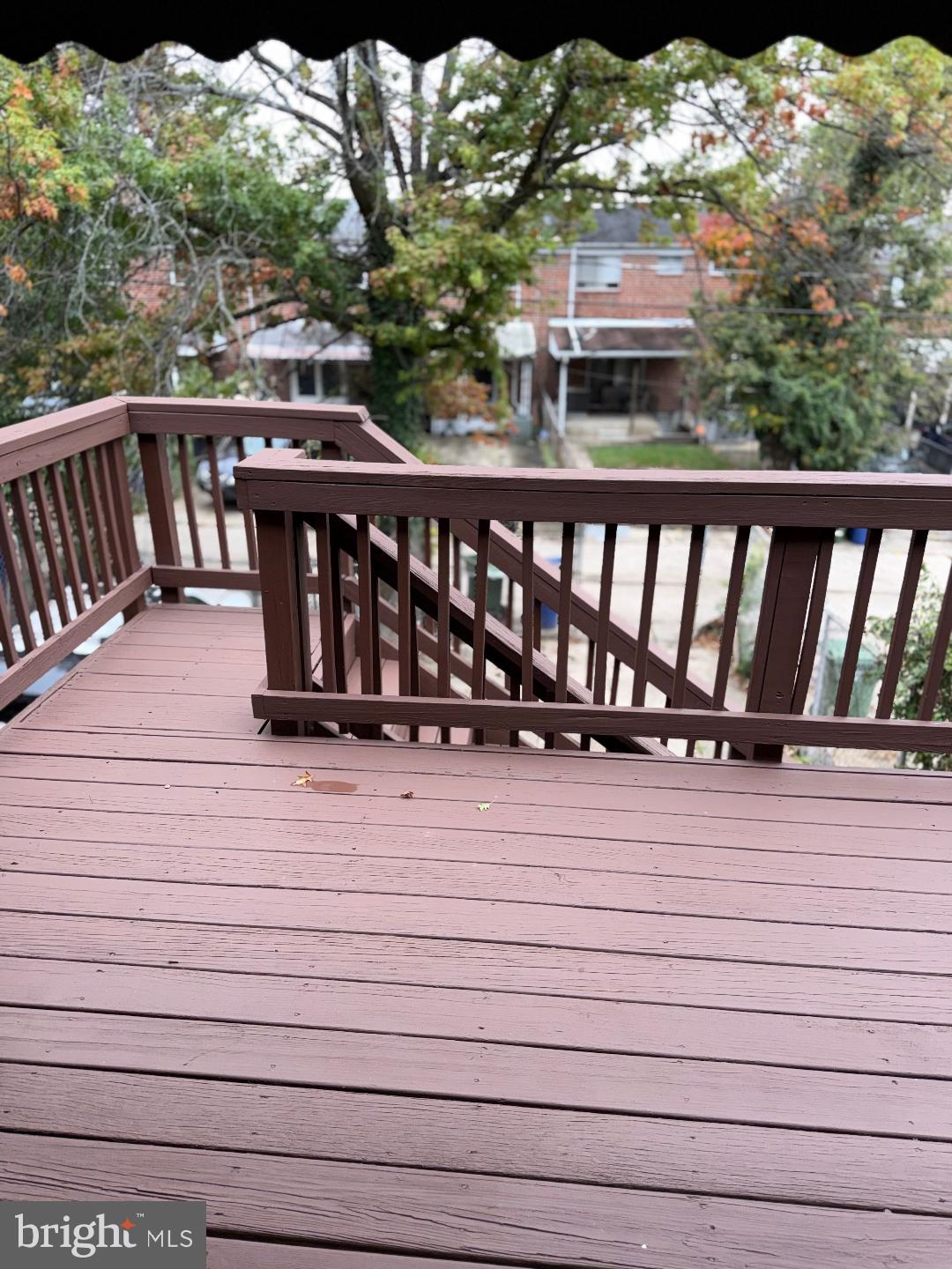 645 Queensgate Road Baltimore, MD 21229 - Photo 19 of 21 a view of a balcony with wooden floor