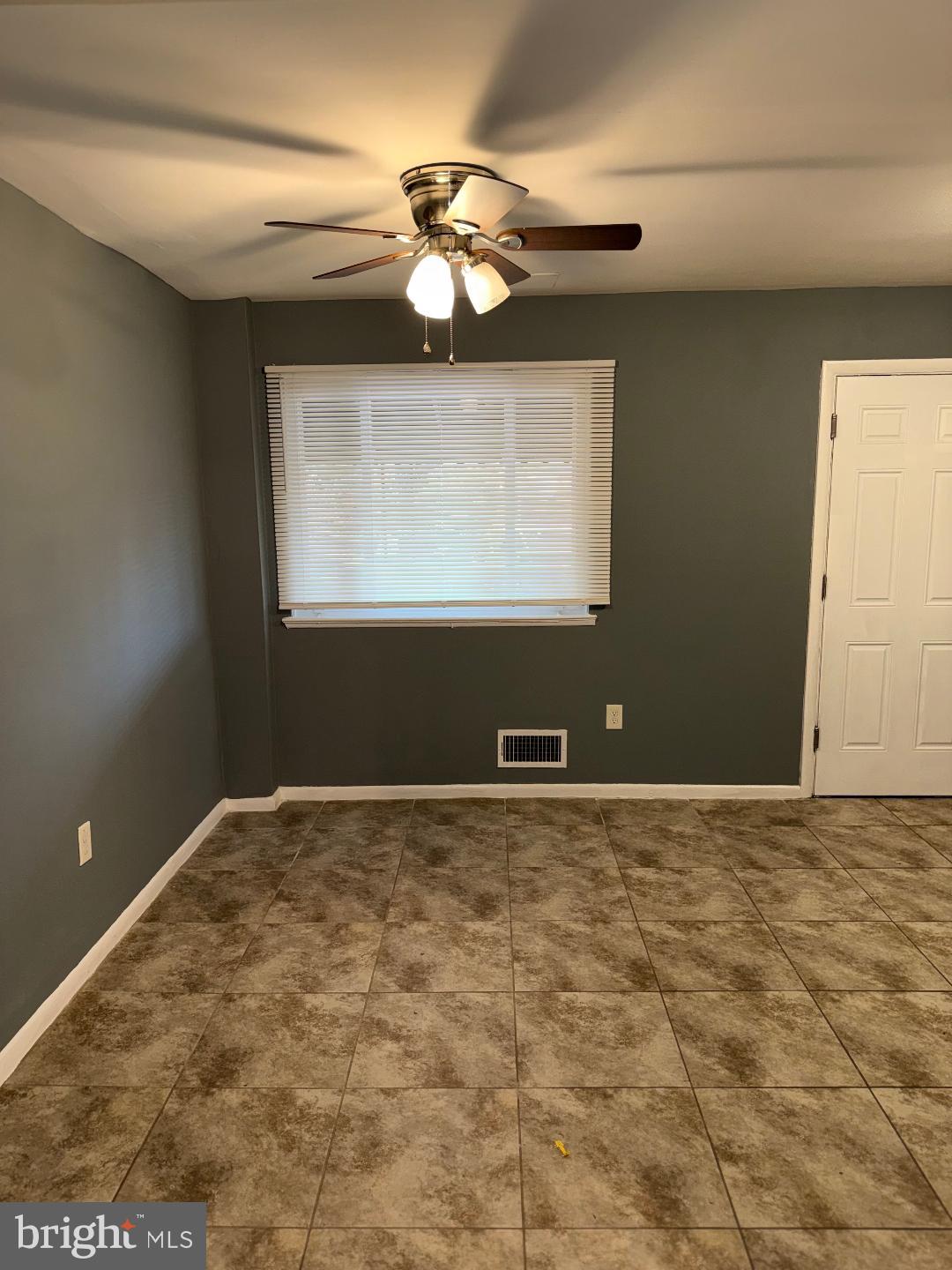 645 Queensgate Road Baltimore, MD 21229 - Photo 4 of 21 a view of an empty room and window