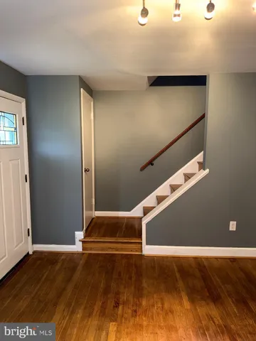 a view of entryway with wooden floor