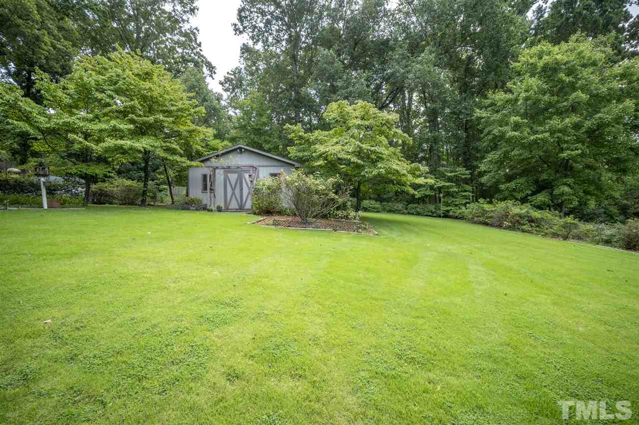 1237 Kingston Ridge Road Cary, NC 27511 - Photo 21 of 23 Amazing flat backyard with shop/storage