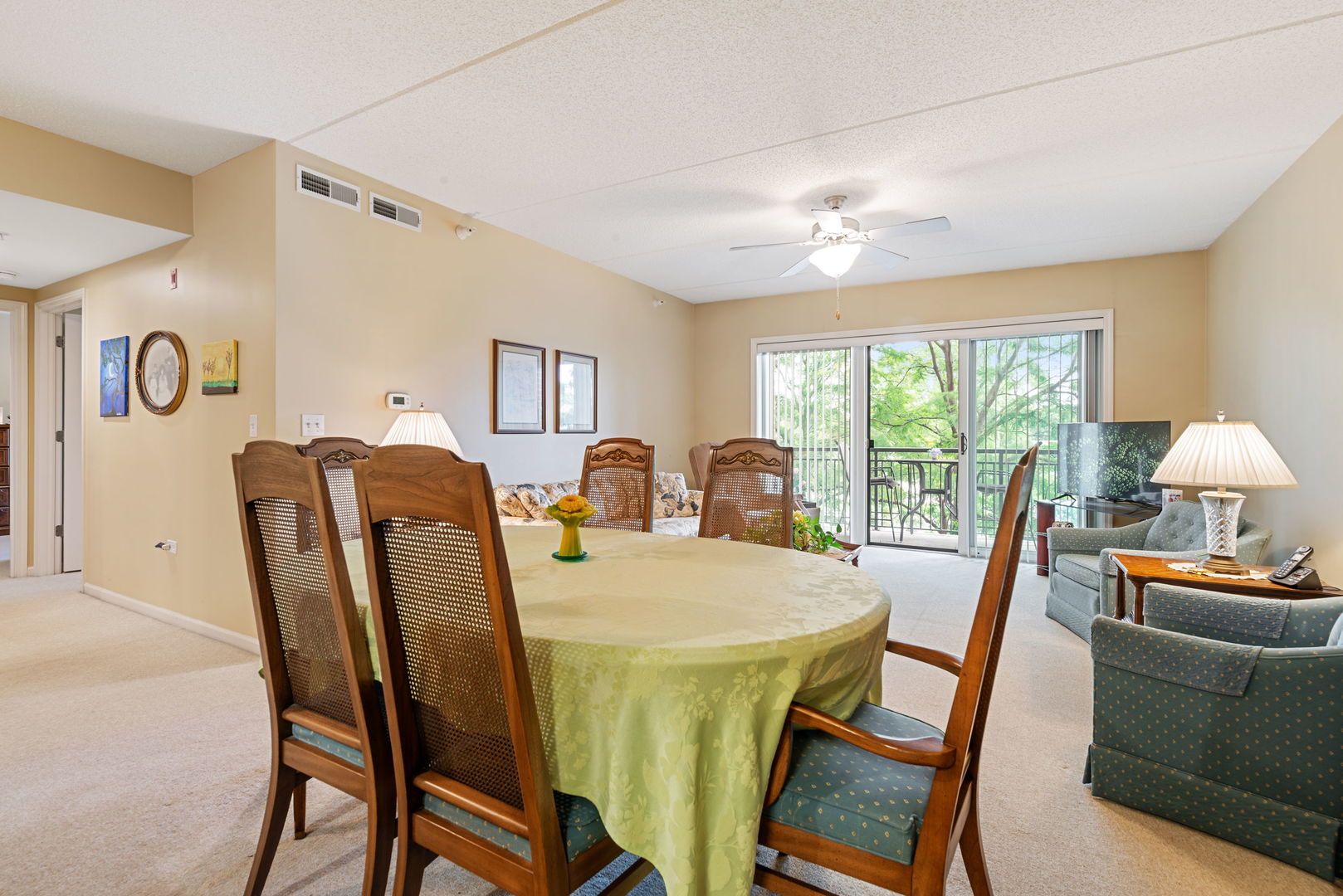 225 Main Street, Unit 201 Roselle, IL 60172 - Photo 11 of 21 a view of a dining room with furniture window and outside view
