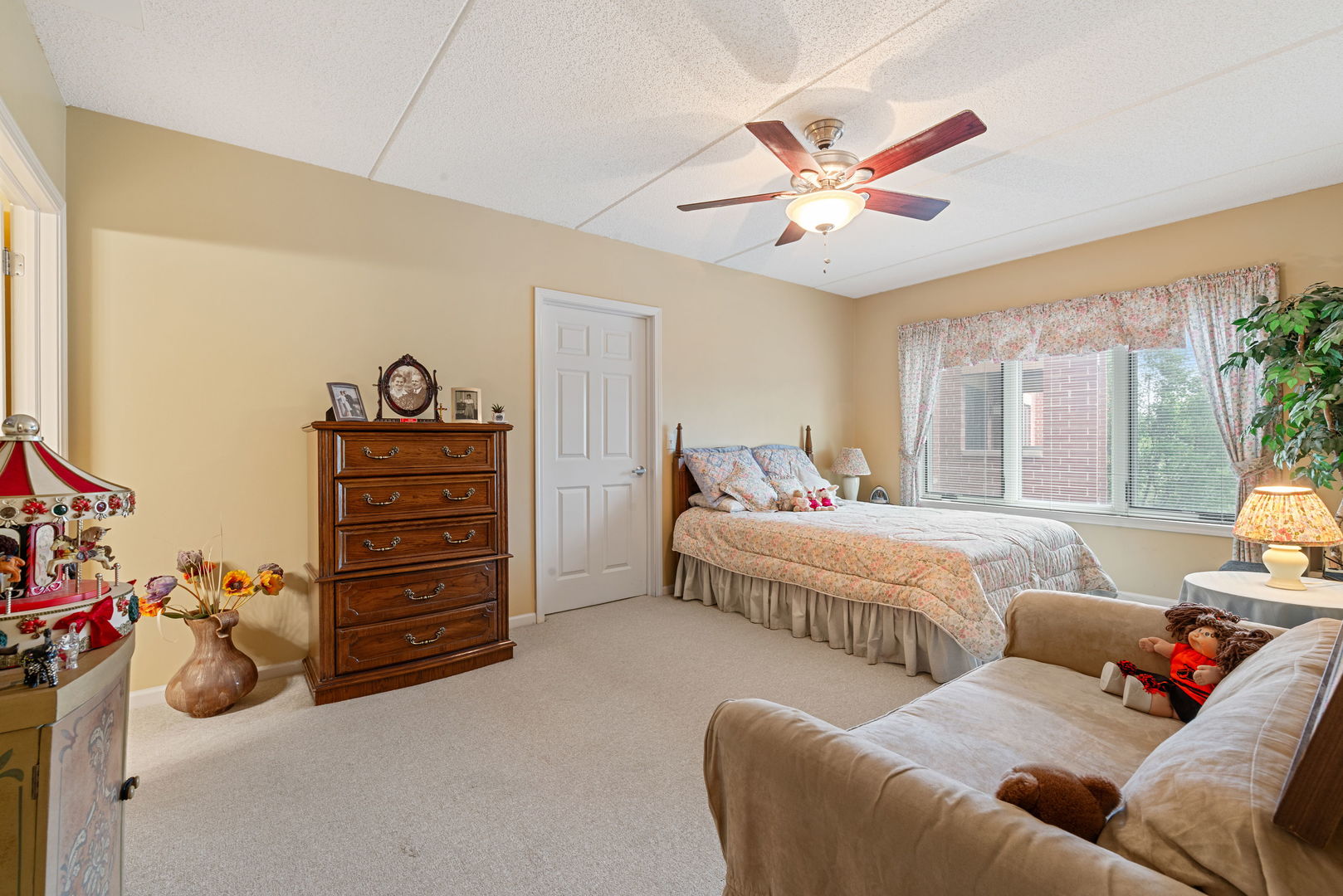 225 Main Street, Unit 201 Roselle, IL 60172 - Photo 12 of 21 a bedroom with furniture and ceiling fan