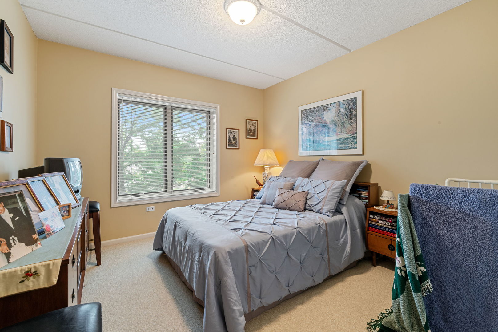 225 Main Street, Unit 201 Roselle, IL 60172 - Photo 16 of 21 a bedroom with a bed and wooden floor