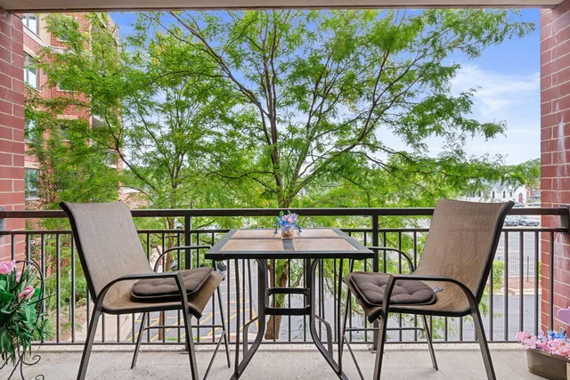 a view of a balcony with chairs