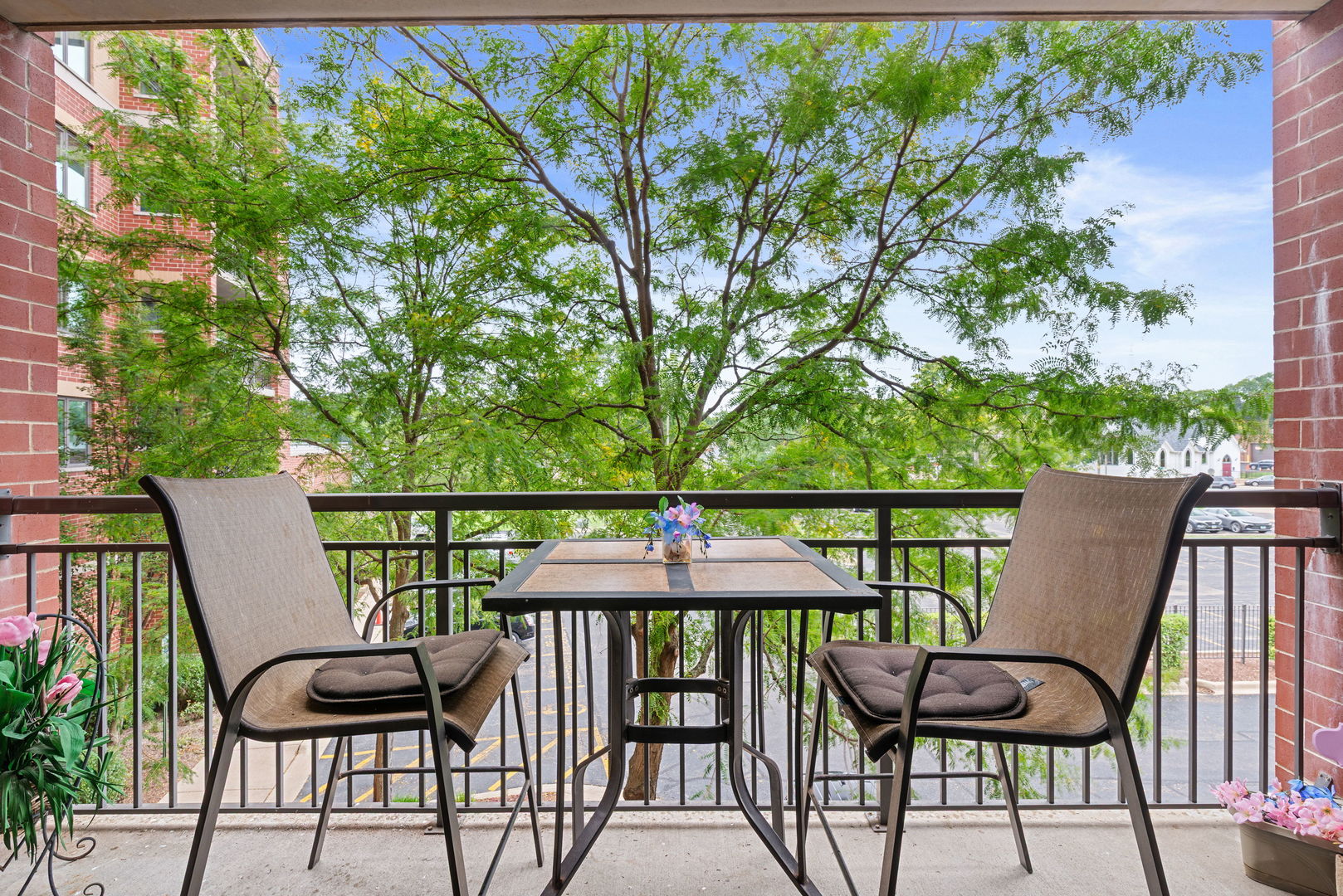 225 Main Street, Unit 201 Roselle, IL 60172 - Photo 18 of 21 a view of a balcony with chairs