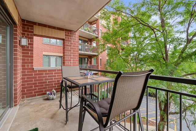 a balcony view with a seating space