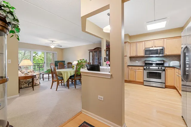 a kitchen with microwave a stove and furniture