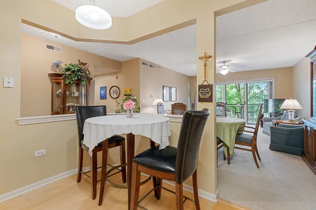 a view of a dining room with furniture and window