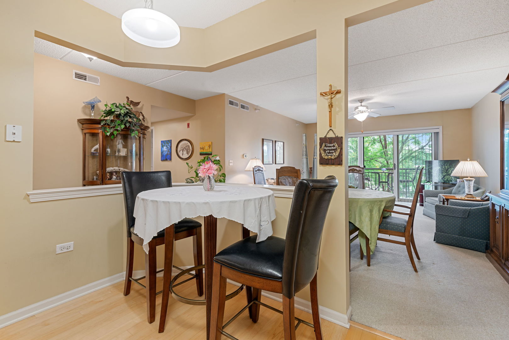 225 Main Street, Unit 201 Roselle, IL 60172 - Photo 10 of 21 a view of a dining room with furniture and window