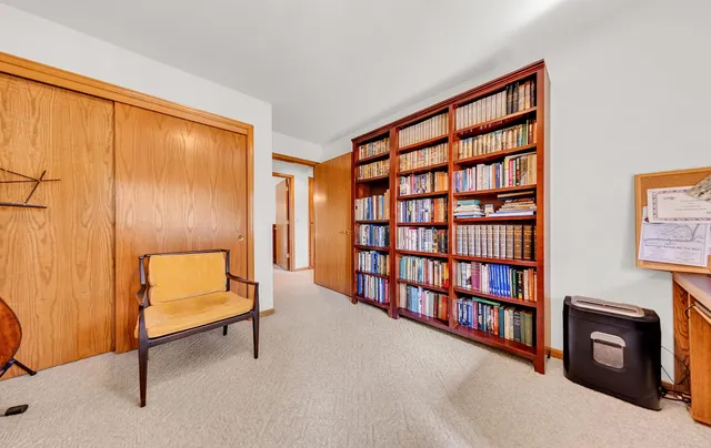 a view of a livingroom with furniture and cabinet
