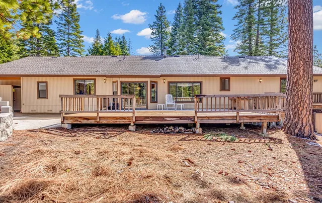 a backyard of a house with a bench and couch