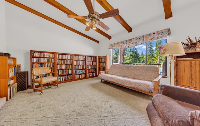 a bedroom with furniture and a window