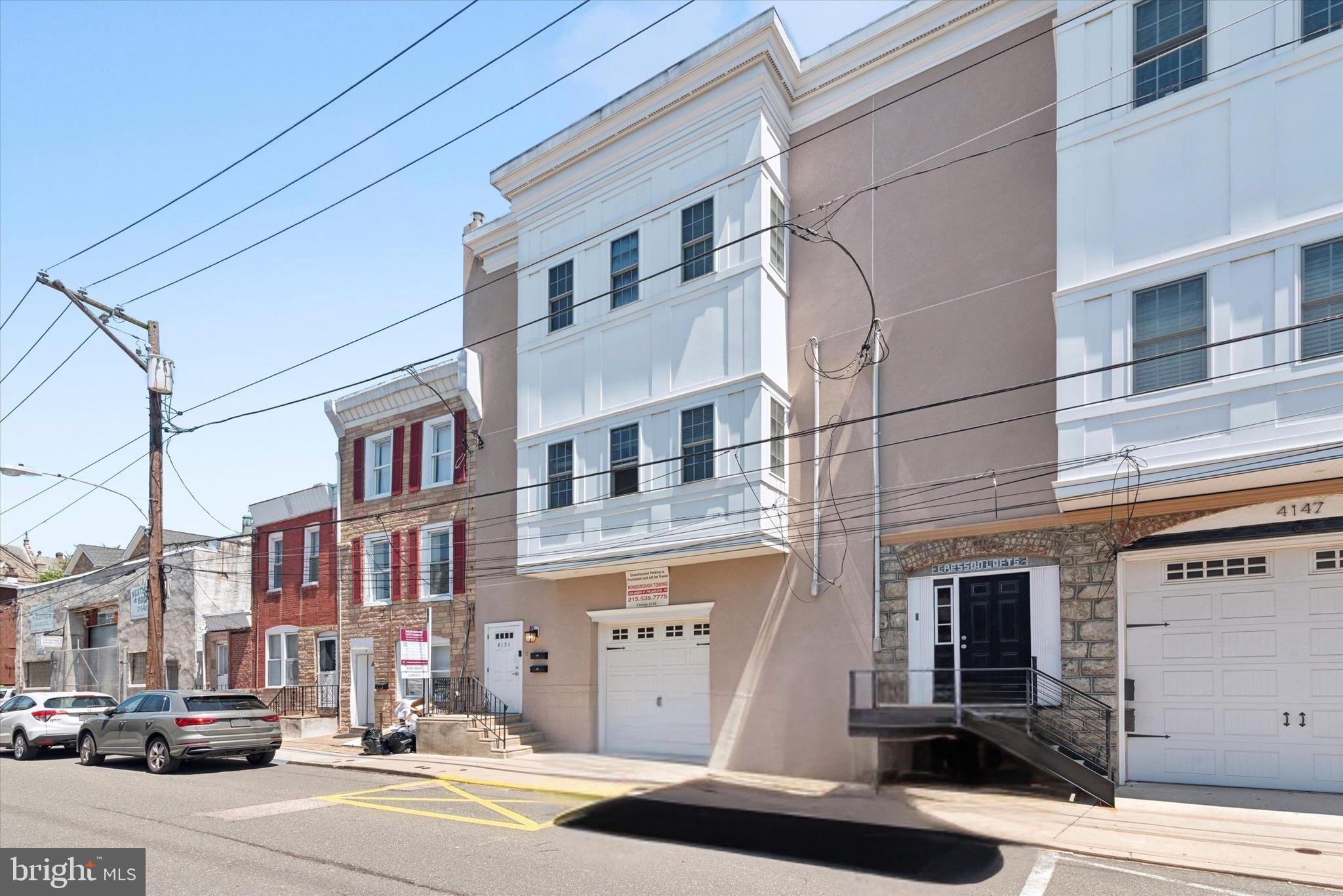 a city street lined with buildings and cars parked on the street