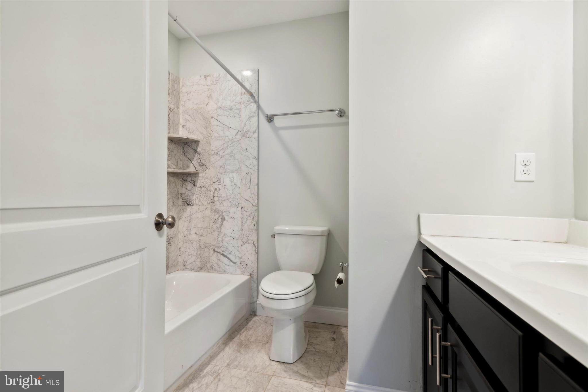 4151 Cresson Street, Unit 3F Philadelphia, PA 19127 - Photo 12 of 15 a bathroom with a sink a toilet and a bathtub