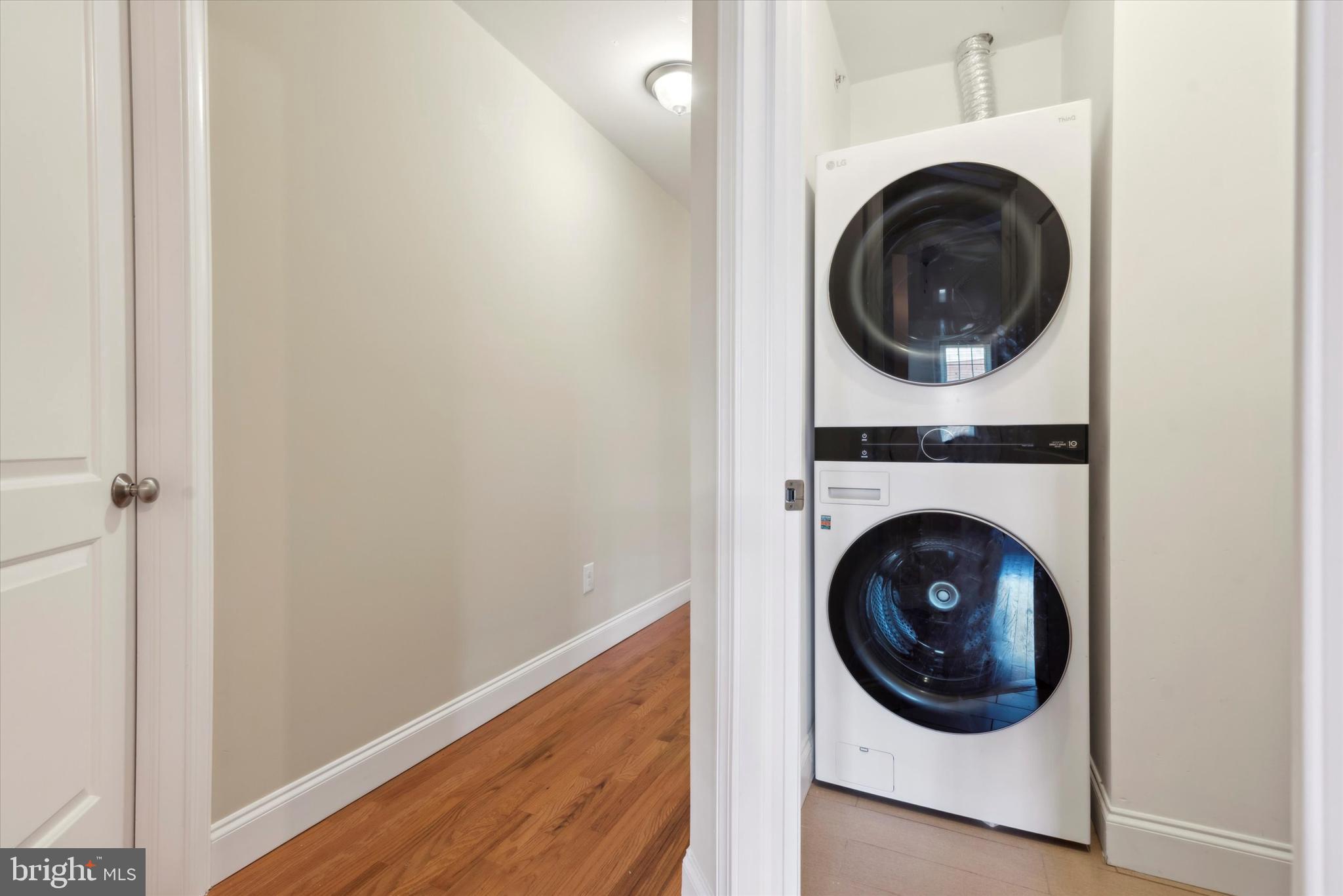 4151 Cresson Street, Unit 3F Philadelphia, PA 19127 - Photo 13 of 15 a view of a hallway with washer and dryer